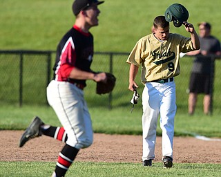 MASSILLON, OHIO - MAY 28, 2015: Joel Hake #9 of Ursuline reacts after flying out to center field for the 3rd out in the bottom of the 7th inning during Thursday nights game at Massillon High School. (Photo by David Dermer/Youngstown Vindicator)