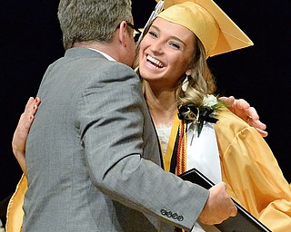 Jeff Lange | The Vindicator  MAY 28, 2015 - Harding honor student Kaitlyn Annandono (right) expresses her joy in receiving her diploma as she walks across the stage during Thursday evening's commencement ceremony at Packard Music Hall in Warren.