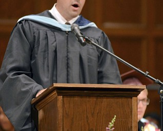 Katie Rickman | The Vindicator. Liberty High School Alumnus David Malone who was apart of the class of 1992 speaks during commencement ceremony at Stambaugh Auditorium.