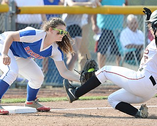 Jeff Lange | The Vindicator  MAY 28, 2015 - Reserve's third baseman Katie Deal (left) puts the tag on Mathews' base runner Lenna Hoff as she slides into third in the bottom of the third inning of their game Thursday at Kent State University.