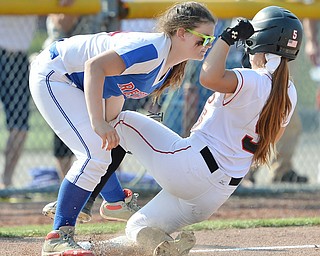 Jeff Lange | The Vindicator  MAY 28, 2015 - Reserve's third baseman Katie Deal (left) puts the tag on Mathews' base runner Lenna Hoff as she slides into third in the bottom of the third inning of their game Thursday at Kent State University.