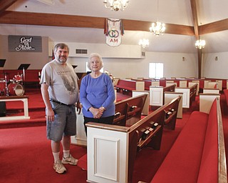        ROBERT K. YOSAY  | THE VINDICATOR..30th of the tornado -..Jeff Barnes and his mother in law Linda Joy Vass inside the church that served food for weeks when the tornado hit