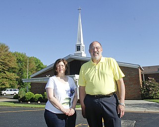        ROBERT K. YOSAY  | THE VINDICATOR..30th of the tornado -..pastor  Rob McFarland at Chestnut Ridge Church Of God- shows the damage to the side of the steel  that was damaged on the church