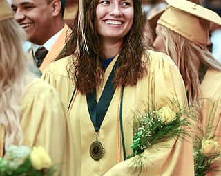 Katie Rickman | The Vindicator.A student smiles at family members and friends during the processional at the one-hundred-seventh Ursuline High School commencement at Stambaugh Auditorium on May 30, 2015.