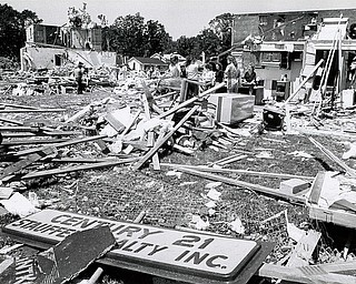Vindicator File Photo | June 1, 1985.Shadow Ridge damage: Residents on Cindy Court, Niles, in the Shadow Ridge Development, spoke in hushed tones as they gathered  in front of their heavily damaged homes. Yards were littered with all kinds of debris, some carried to the scene by the tornado.