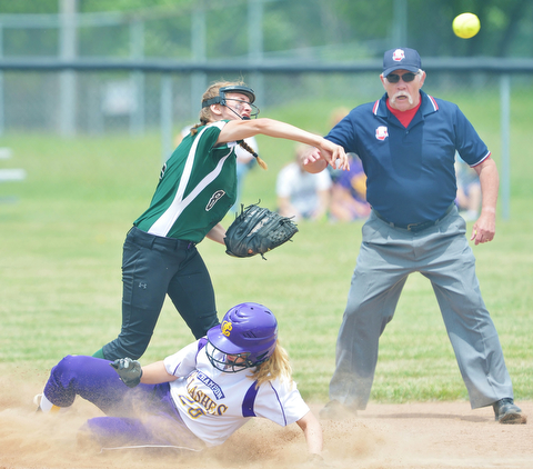 Jeff Lange | The Vindicator  MAY 30, 2015 - Champion base runner Alayna Fell (bottom) slides into second as Elyria shortstop Sam Filiaggi attempts to make the double play during second inning action of their regional championship game, Saturday afternoon in Massillon.
