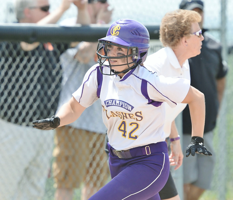 Jeff Lange | The Vindicator  MAY 30, 2015 - Champion base runner Amber Ricci (42) rounds third on her way to home in the bottom of the fifth inning against Elyria, Saturday afternoon in Massillon.