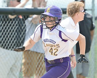 Jeff Lange | The Vindicator  MAY 30, 2015 - Champion base runner Amber Ricci (42) rounds third on her way to home in the bottom of the fifth inning against Elyria, Saturday afternoon in Massillon.