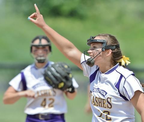 Jeff Lange | The Vindicator  MAY 30, 2015 - Flashes' winning pitcher Haylee Gardiner (right) shows her teammates that there is only one out left in the game in the top of the seventh inning against Elyria in the regional championship game at Massillon High school.