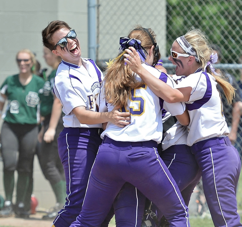 Jeff Lange | The Vindicator  MAY 30, 2015 - Flashes' second baseman Carissa Hurst (left) celebrates with teammates Megan Turner (center) and Brittany Allen at home plate after defeating the Elyria Catholic Panthers 4-0 in the regional championship game at Massillon High School, Saturday afternoon.