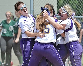 Jeff Lange | The Vindicator  MAY 30, 2015 - Flashes' second baseman Carissa Hurst (left) celebrates with teammates Megan Turner (center) and Brittany Allen at home plate after defeating the Elyria Catholic Panthers 4-0 in the regional championship game at Massillon High School, Saturday afternoon.