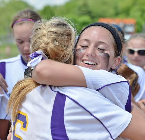 Jeff Lange | The Vindicator  MAY 30, 2015 - Champion's Amber Ricci (right) embraces teammate Brittany Allen after the Flashes' regional championship victory against the Elyria Catholic Panthers, Saturday afternoon in Massillon.