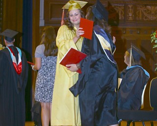 Mike Capps | The Vindicator.After receiving her diploma, Mooney graduate Amanda Yarger hugs mom Teresa Yarger..