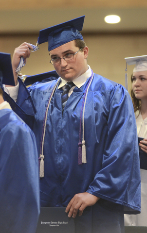 Katie Rickman | The Vindicator.Joel Thomas Stockslager moves his tassel from right to left becoming an official graduate of Youngstown Christian School during the ceremony at Highway Tabernacle on May 31, 2015.