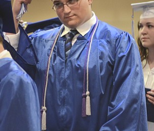 Katie Rickman | The Vindicator.Joel Thomas Stockslager moves his tassel from right to left becoming an official graduate of Youngstown Christian School during the ceremony at Highway Tabernacle on May 31, 2015.