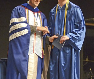 Katie Rickman | The Vindicator. Stephen Richard Breidenstein shakes hands with Mike Pecchia while receiving his diploma at the Youngstown Christian School graduation at Highway Tabernacle on May 31, 2015.