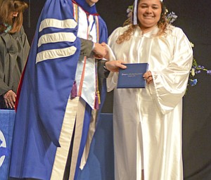 Katie Rickman | The Vindicator.Alisia De'Lia Rivera shakes hands with Mike Pecchia while receiving her diploma at the Youngstown Christian School graduation at Highway Tabernacle on May 31, 2015.