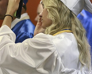 Katie Rickman | The Vindicator.Youngstown Christian School graduate Payton Schnabl looks at her reflection to ensure that her cap was in place minutes before the graduation ceremony began at Highway Tabernacle on May 31, 2015.