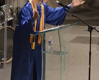 Katie Rickman | The Vindicator.Co-Valedictorian Vincent Talley puts his hands in the air while excitedly saying that the graduates had finally made it to graduation day during the Youngstown Christian School ceremony at Highway Tabernacle on May 31, 2015.