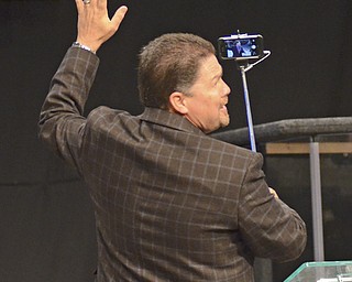 Katie Rickman | The Vindicator.Rev. Gary Gray, lead pastor of Highway Tabernacle waves as he takes a selfie with the graduating class using a "selfie stick" prior to giving the commencement address at Youngstown Christian School graduation at Highway Tabernacle on May 31, 2015.
