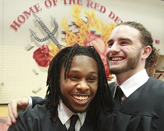 William D. Lewis The Vindicator  Campbell Memorial grads Emonee Johnson, left, and Cam Collins  celebrate at end of commencement ceremony 6-4-15 at Campbell HS.