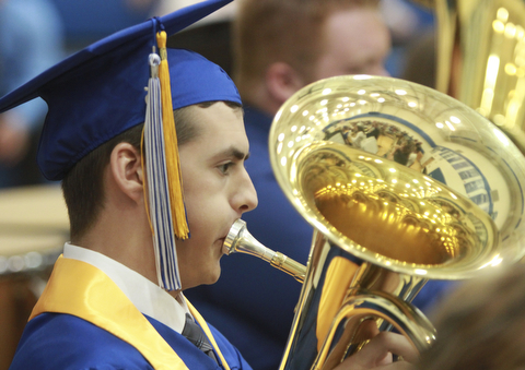 William D. Lewis The Vindicator  Jackson Milton grad Thomas Carnes plays one last number with hte band during Friday commencement at JM HS. He also was one of 8 valedictorians.