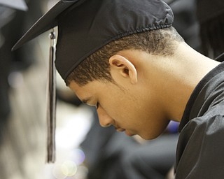        ROBERT K. YOSAY  | THE VINDICATOR..Xavier Jackson  reflects on his diploma at the  Mahoning County High School graduation.the former  P.S. Berry School,