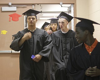        ROBERT K. YOSAY  | THE VINDICATOR..Graduates of MCHS  file in to the ceremonies at  Mahoning County High School graduation.the former  P.S. Berry School,