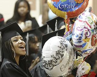        ROBERT K. YOSAY  | THE VINDICATOR..Super time with balloons and cheers as Nyhuh (ok) Dawson  cheers on her classmates . Mahoning County High School graduation.the former  P.S. Berry School,