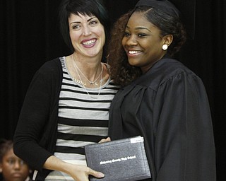        ROBERT K. YOSAY  | THE VINDICATOR.. Victoria Brodzinski  present diploma Shawndaya Brown. Mahoning County High School graduation.the former  P.S. Berry School,