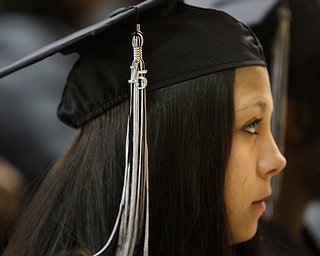        ROBERT K. YOSAY  | THE VINDICATOR..Listening intently to  Mr Traficanti - Kiara Jackson - and the NUMBER 15-.. Mahoning County High School graduation.the former  P.S. Berry School,