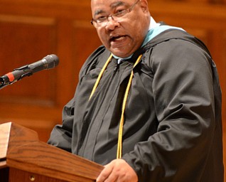 Katie Rickman | The Vindicator.East High School's principal Tryvan Leech addresses graduates and attendees during the commencement ceremony at Stambaugh Auditorium.