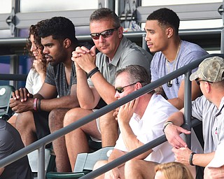 COLUMBUS, OHIO - JUNE 5, 2015: Ohio State head football coach Urban Meyer watches the baseball game with running backs Jalin Marshall (right) and Ezekiel Elliott (left) during Friday mornings Division 2 semi-final game at Huntington Park. Poland won 2-0. (Photo by David Dermer/Youngstown Vindicator)