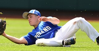 COLUMBUS, OHIO - JUNE 5, 2015: Center fielder Eric White #2 of Poland slides on the ground after the baseball hit the ground after he dove to attempt a catch during the bottom of the 7th inning during Friday mornings Division 2 semi-final game at Huntington Park. Poland won 2-0. (Photo by David Dermer/Youngstown Vindicator)