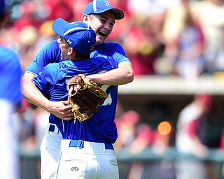 COLUMBUS, OHIO - JUNE 5, 2015: Pitcher Jared Burkert #6 of Poland hugs teammate Dom Drummond #22 after the final strike out in the bottom of the 7th inning during Friday mornings Division 2 semi-final game at Huntington Park. Poland won 2-0. (Photo by David Dermer/Youngstown Vindicator)