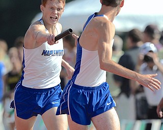 Jeff Lange | The Vindicator  JUNE 5, 2015 - Maplewood's Allen Sparks (left) hands off the baton to teammate Derek Morrison during Friday morning's boys 4x800 meter relay in the 2015 state track and field tournament at Ohio State's Jesse Owens Memorial Stadium in Columbus. Maplewood's 4x800 team finished first with a combined time of 7:49.02.