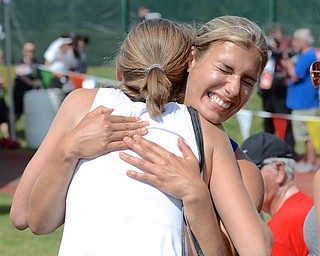 Jeff Lange | The Vindicator  JUNE 5, 2015 - Poland's Nicolette Kreatsoulas (right) smiles as she hugs teammate Gracie Kennedy after throwing 137 feet 8 inches, capturing second place in the girls discus event, Friday during the 2015 state track and field tournament held at Jesse Owens Memorial Stadium in Columbus.
