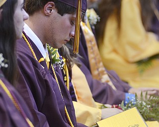 Katie Rickman | The Vindicator.Kirklin Grahovac looks down at his diploma shortly after taking his seat after receiving it at South Range High School on June 6, 2015.