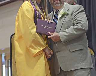 Katie Rickman | The Vindicator.Jayden Mackenzie Dunn, 1 of 17 Valedictiorians, smiles as Ralph Wince hands  her diploma to her at South Range High School graduation on June 6, 2015.