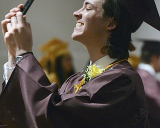 Katie Rickman | The Vindicator.Wesley Montgomery smiles and takes a photo as he waited with fellow graduates for the ceremony to begin at South Range High School on June 6, 2015.