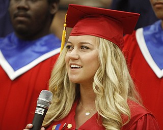      .         ROBERT  K. YOSAY | THE VINDICATOR..Singing a solo in her last appearance in the choir was  Casey Infante. Over 300 Austintown Fitch graduates received their diplomas at Saturday Morning commencement in the High School Gym..-30-