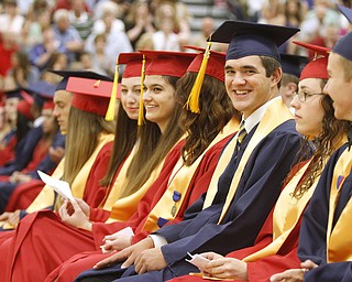       .         ROBERT  K. YOSAY | THE VINDICATOR..fitch valedictorians share a smile as festivities began. Over 300 Austintown Fitch graduates received their diplomas at Saturday Morning commencement in the High School Gym..-30-