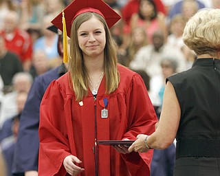       .         ROBERT  K. YOSAY | THE VINDICATOR..all smiles as our own Logan Skolnick gets congratulated by School Board Presiden- Over 300 Austintown Fitch graduates received their diplomas at Saturday Morning commencement in the High School Gym..-30-