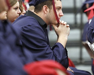       .         ROBERT  K. YOSAY | THE VINDICATOR..listening to Principal Christopher Berni is Senior Cameron Smith.. Over 300 Austintown Fitch graduates received their diplomas at Saturday Morning commencement in the High School Gym..-30-