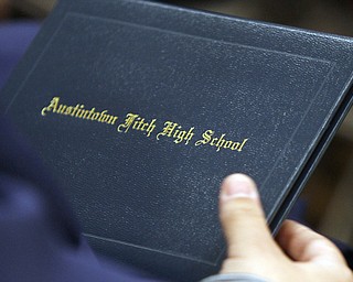       .         ROBERT  K. YOSAY | THE VINDICATOR... Over 300 Austintown Fitch graduates received their diplomas at Saturday Morning commencement in the High School Gym..-30-