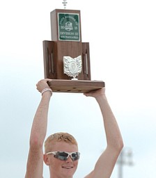 Jeff Lange | The Vindicator  JUNE 6, 2015 - Maplewood's Derek Morrison lifts the DIII team state runner-up trophy during Saturday's 2015 state track and field tournament held at Jesse Owens Memorial Stadium in Columbus.