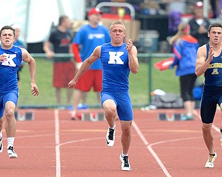 Jeff Lange | The Vindicator  JUNE 6, 2015 - Warren JFK's Chad Zallow (center) sprints to the finish, leading teammate Jacob Coates (left) and Archibold opponent Levi Wyse in the DIII boys 100 meter dash during Saturday's 2015 state track and field tournament held at Jesse Owens Memorial Stadium in Columbus.