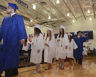 Katie Rickman | The Vindicator.Students walk into the field house at Poland High School, some waving at family and friends during the commencement ceremony on Sunday June 7, 2015.