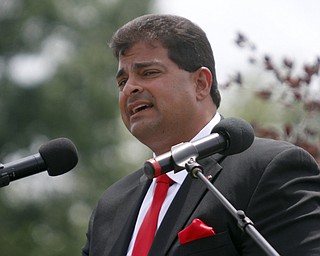       .         ROBERT  K. YOSAY | THE VINDICATOR..Alex Geordan superintendent introduces the commencement speaker..Canfield High School Graduation on the football field in Canfield..-30-
