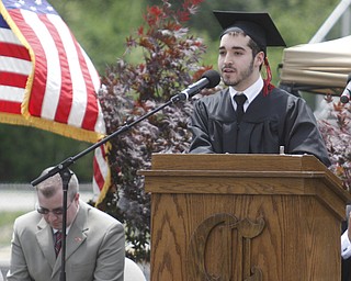       .         ROBERT  K. YOSAY | THE VINDICATOR..Giving the invocation is  Neal Timlin,class president..Canfield High School Graduation on the football field in Canfield..-30-
